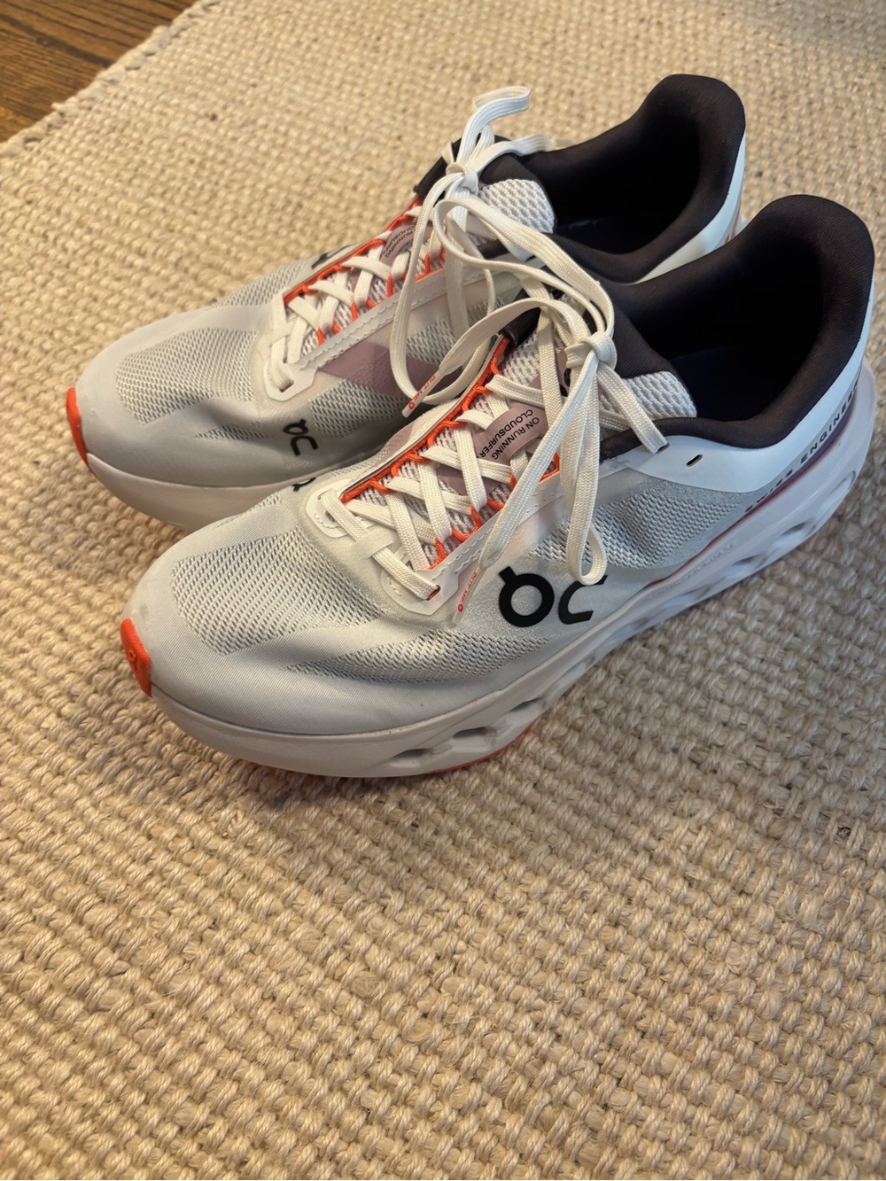 On Running womens Cloudsurfer Next shoes in White with Orange Accents - Picture 3 of 5
